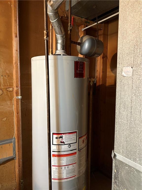 utility room with gas water heater