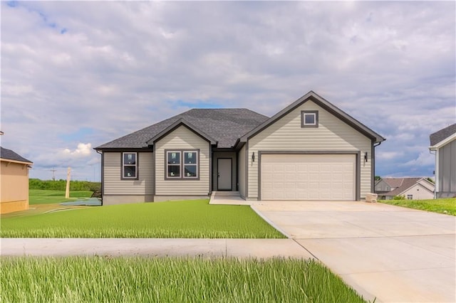 929 168th Ter, Basehor, KS 66007 - ranch-style house with concrete driveway, an attached garage, and a front lawn