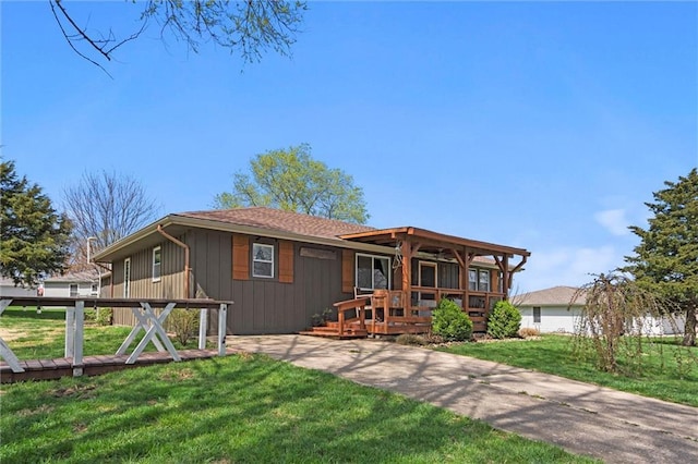502 N Main St, Trimble, MO 64492 - view of front of property featuring a wooden deck and a front lawn