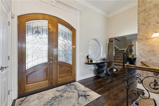 entrance foyer with french doors, baseboards, stairs, ornamental molding, and wood-type flooring