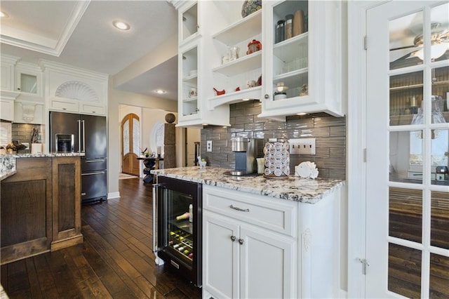 bar with backsplash, dark wood-style flooring, black fridge, wine cooler, and recessed lighting