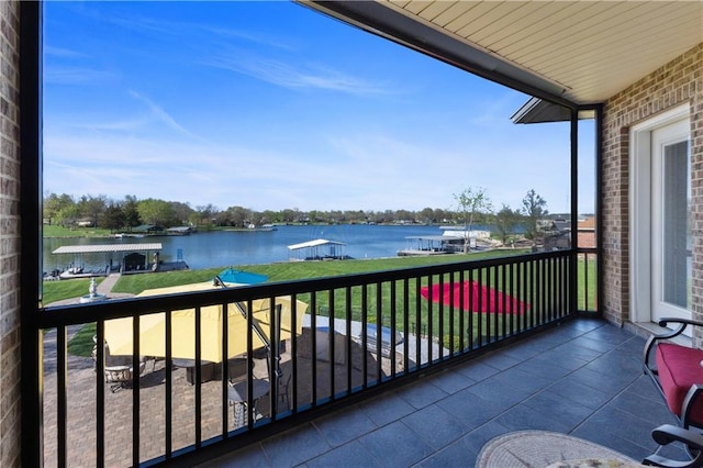 balcony featuring a water view