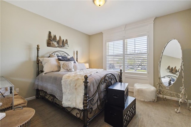 bedroom with carpet flooring and baseboards