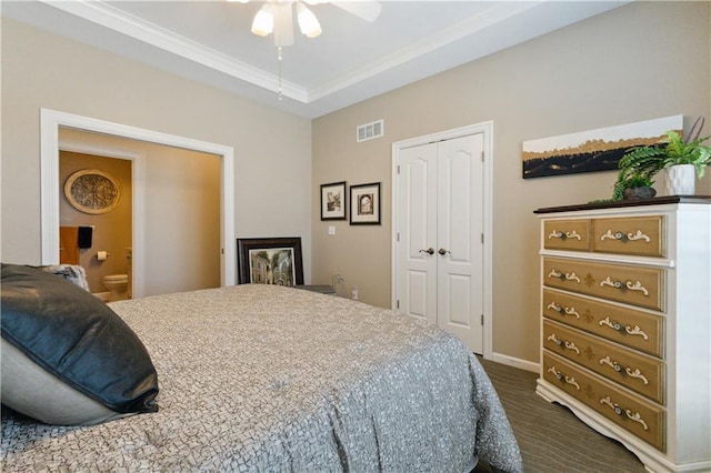 bedroom featuring a closet, ceiling fan, baseboards, dark colored carpet, and visible vents