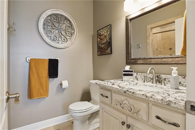 full bath with tile patterned flooring, toilet, vanity, baseboards, and walk in shower