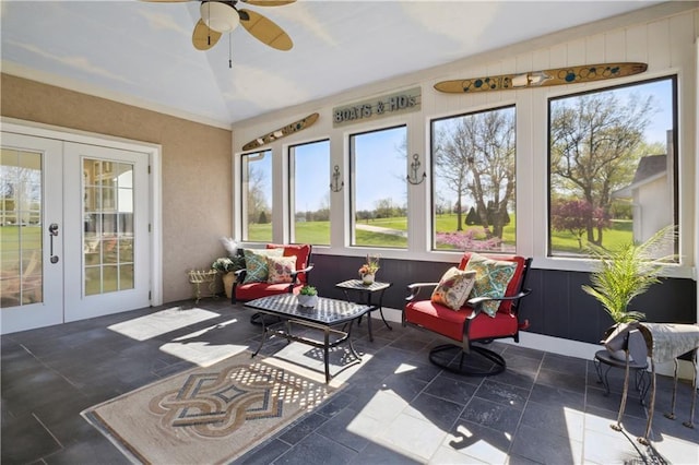 sunroom / solarium with lofted ceiling, french doors, and plenty of natural light