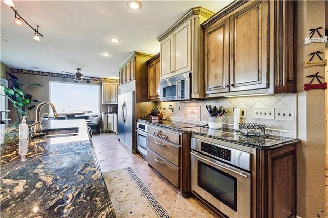 113 Lighthouse Pt, Gallatin, MO 64640 - kitchen featuring recessed lighting, tasteful backsplash, appliances with stainless steel finishes, and a sink