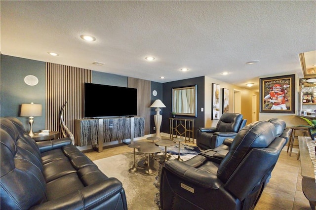 living room featuring baseboards, recessed lighting, and a textured ceiling