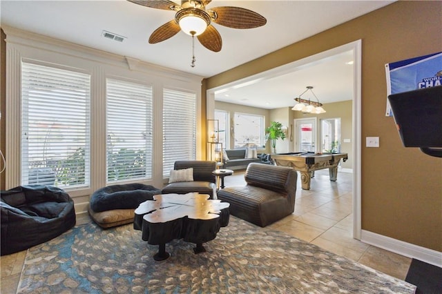 living room featuring light tile patterned flooring, baseboards, visible vents, ceiling fan, and pool table