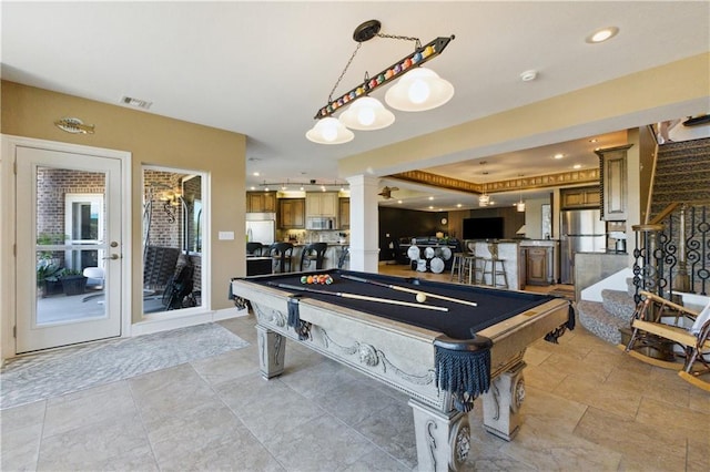 playroom with visible vents, ornate columns, and billiards