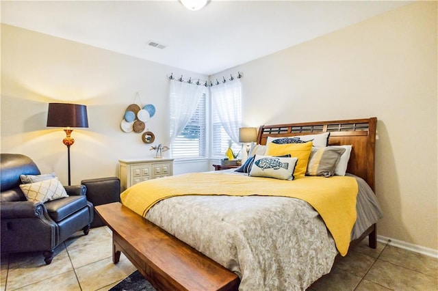 tiled bedroom featuring visible vents and baseboards