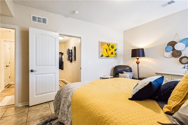 bedroom featuring visible vents and tile patterned floors