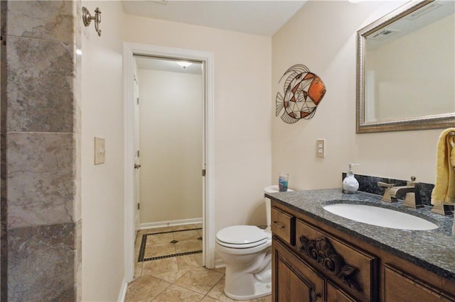 bathroom featuring vanity, baseboards, toilet, tile patterned flooring, and visible vents
