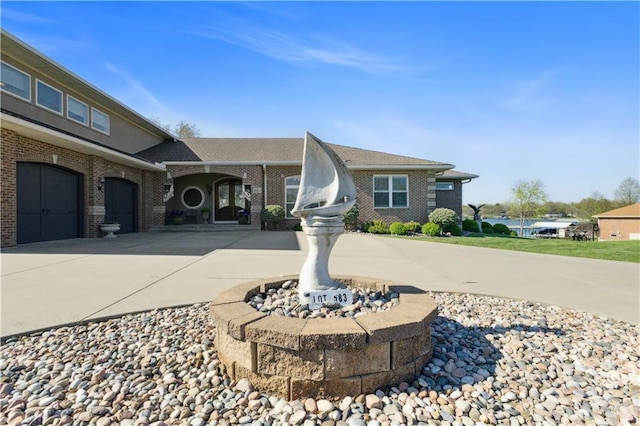 ranch-style house with brick siding and concrete driveway