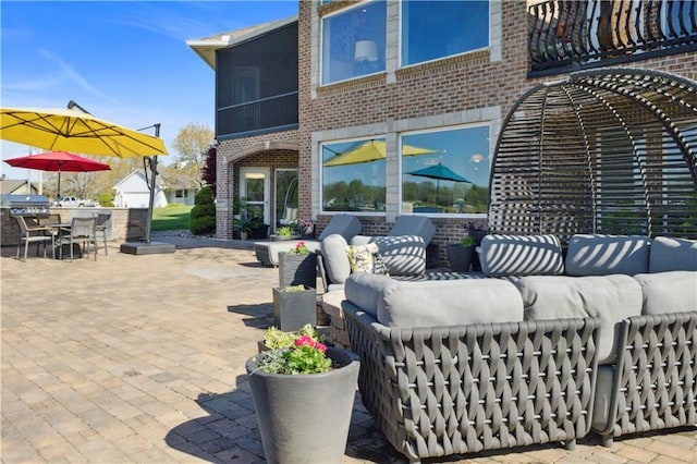 view of patio with an outdoor living space and outdoor dining space