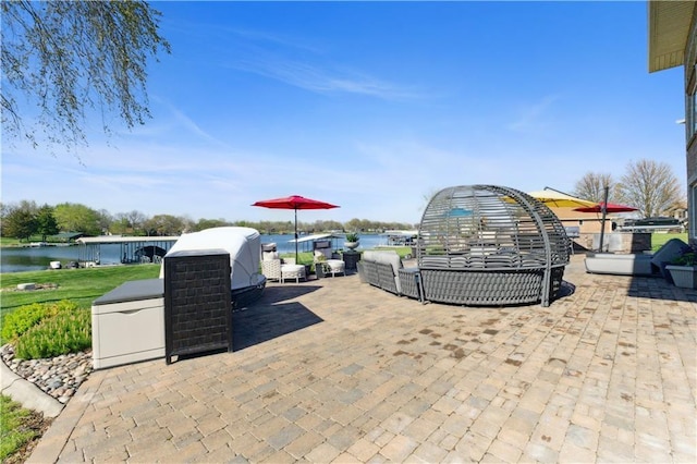 view of patio / terrace featuring a water view and an outdoor hangout area