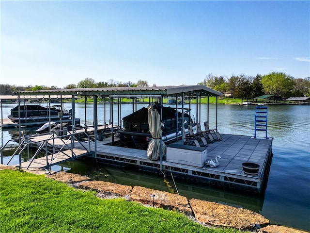 dock area featuring boat lift and a water view