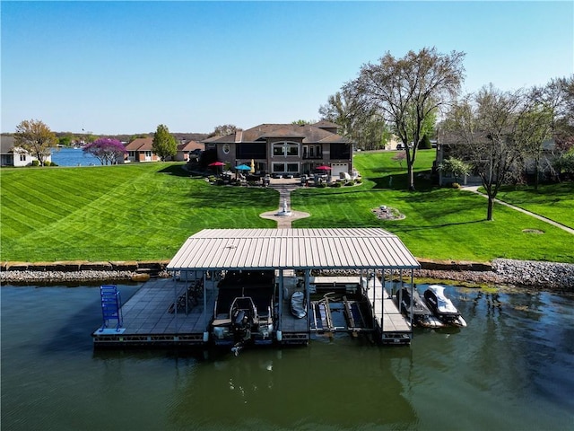 dock area featuring a yard, boat lift, and a water view
