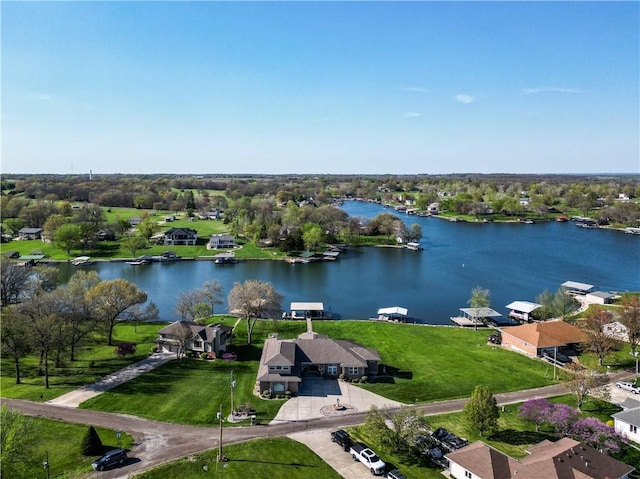drone / aerial view with a water view and a residential view