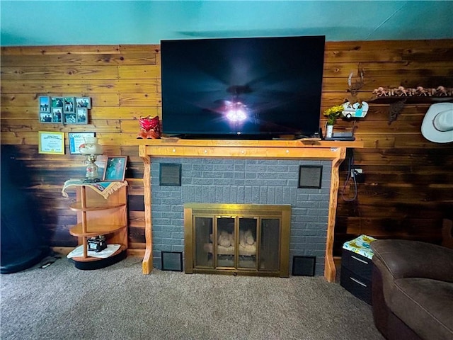 1124 Pacific Ave, Osawatomie, KS 66064 - living area featuring wooden walls, carpet floors, and a brick fireplace