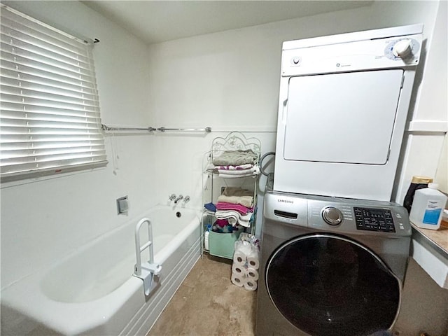 1124 Pacific Ave, Osawatomie, KS 66064 - laundry room featuring estacked washer and dryer