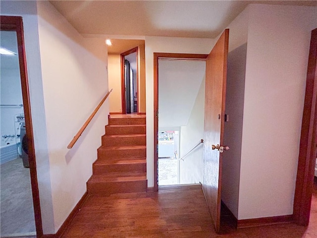 1124 Pacific Ave, Osawatomie, KS 66064 - stairway with baseboards and wood finished floors