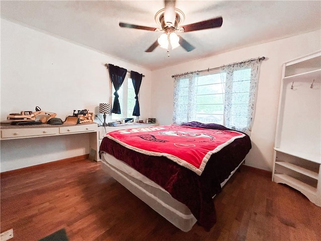 1124 Pacific Ave, Osawatomie, KS 66064 - bedroom with wood finished floors and a ceiling fan