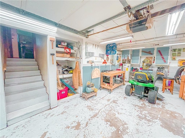 1124 Pacific Ave, Osawatomie, KS 66064 - garage featuring a garage door opener and water heater