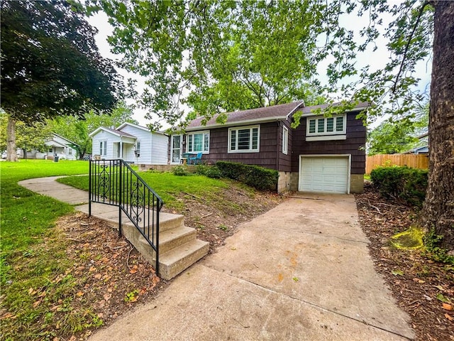 1124 Pacific Ave, Osawatomie, KS 66064 - ranch-style house with an attached garage and driveway