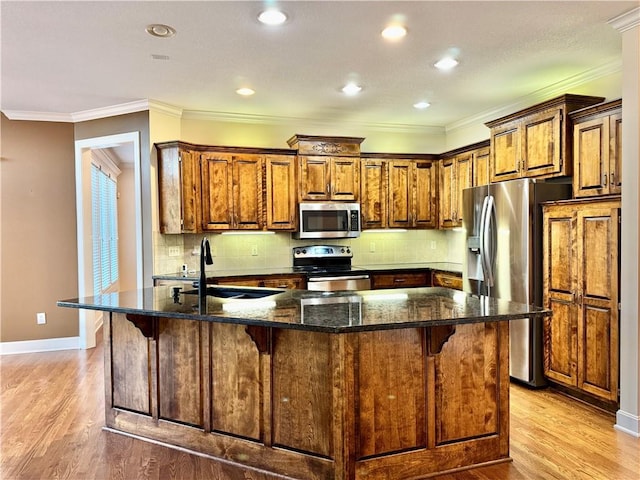14413 Stearns St, Overland Park, KS 66211 - kitchen with appliances with stainless steel finishes, a sink, baseboards, a breakfast bar area, and light wood-type flooring