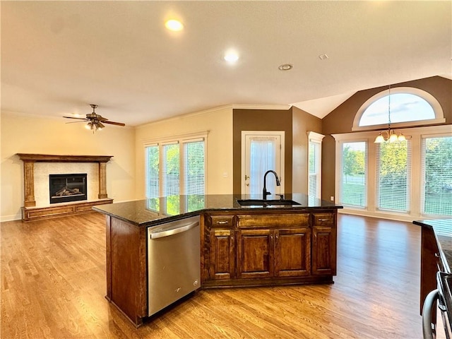14413 Stearns St, Overland Park, KS 66211 - kitchen featuring stainless steel dishwasher, a sink, ceiling fan, light wood finished floors, and healthy amount of natural light