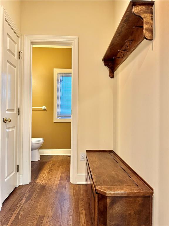 14413 Stearns St, Overland Park, KS 66211 - bathroom with wood finished floors, toilet, and baseboards
