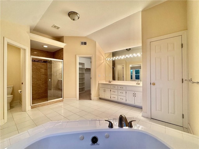 14413 Stearns St, Overland Park, KS 66211 - bathroom featuring a shower stall, double vanity, vaulted ceiling, toilet, and tile patterned floors