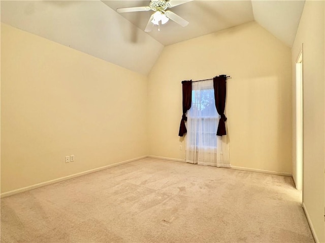 14413 Stearns St, Overland Park, KS 66211 - empty room with lofted ceiling, light carpet, ceiling fan, and baseboards