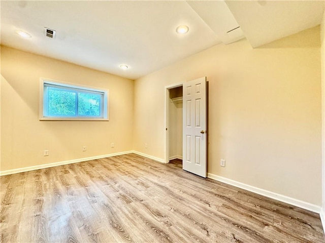 14413 Stearns St, Overland Park, KS 66211 - unfurnished bedroom with wood finished floors, baseboards, and recessed lighting