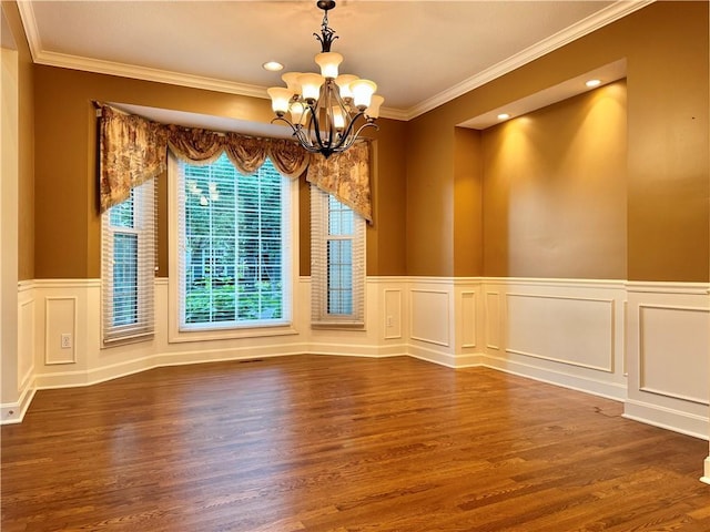 14413 Stearns St, Overland Park, KS 66211 - unfurnished dining area featuring a chandelier, wood finished floors, crown molding, a wainscoted wall, and a decorative wall