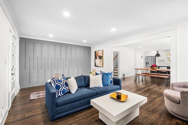 5933 Rockhill Rd, Kansas City, MO 64110 - living area featuring stairs, crown molding, wood finished floors, recessed lighting, and a decorative wall