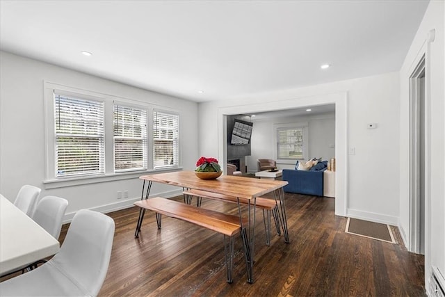 5933 Rockhill Rd, Kansas City, MO 64110 - dining room featuring wood finished floors, baseboards, and recessed lighting