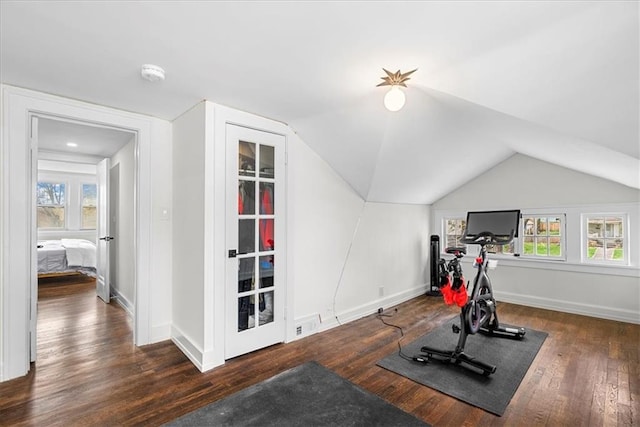 5933 Rockhill Rd, Kansas City, MO 64110 - workout room with wood finished floors, vaulted ceiling, and baseboards