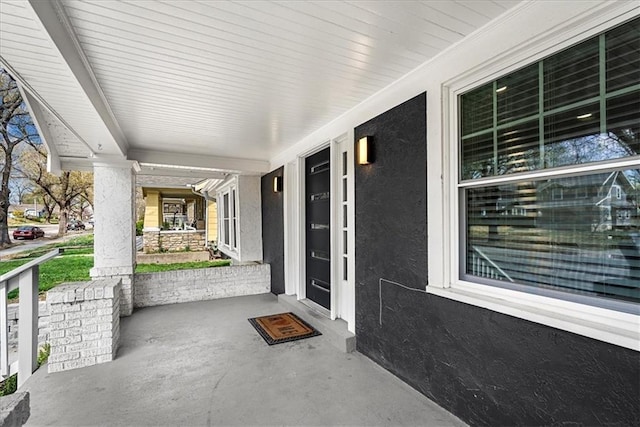 5933 Rockhill Rd, Kansas City, MO 64110 - view of patio / terrace featuring covered porch