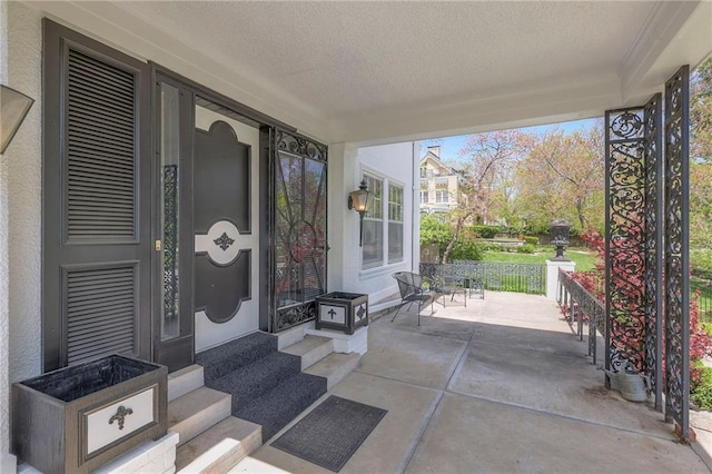 property entrance featuring a porch