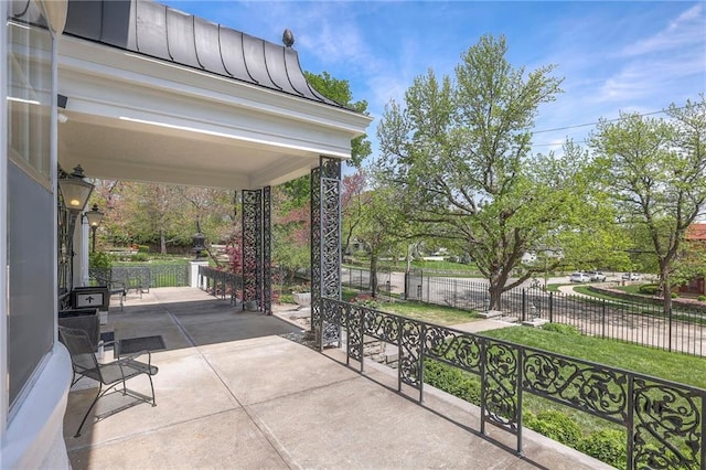 view of patio / terrace featuring fence