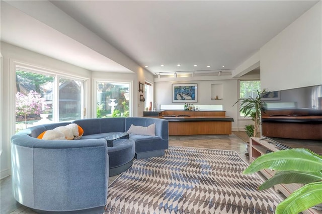 living area featuring recessed lighting and a wealth of natural light