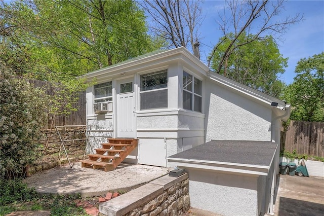 exterior space featuring fence and entry steps