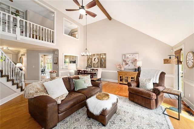 17014 NE 119th St, Kearney, MO 64060 - living area featuring ceiling fan, wood finished floors, stairway, high vaulted ceiling, and a chandelier