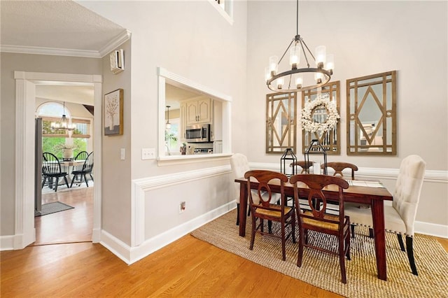 17014 NE 119th St, Kearney, MO 64060 - dining space with a chandelier, light wood-style flooring, ornamental molding, and baseboards