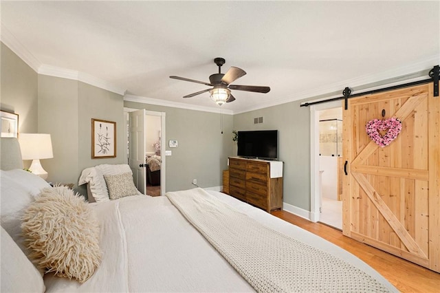 17014 NE 119th St, Kearney, MO 64060 - bedroom featuring wood finished floors, a barn door, ornamental molding, a ceiling fan, and baseboards