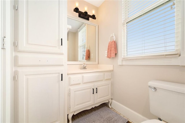 17014 NE 119th St, Kearney, MO 64060 - bathroom with baseboards, tile patterned floors, vanity, and toilet
