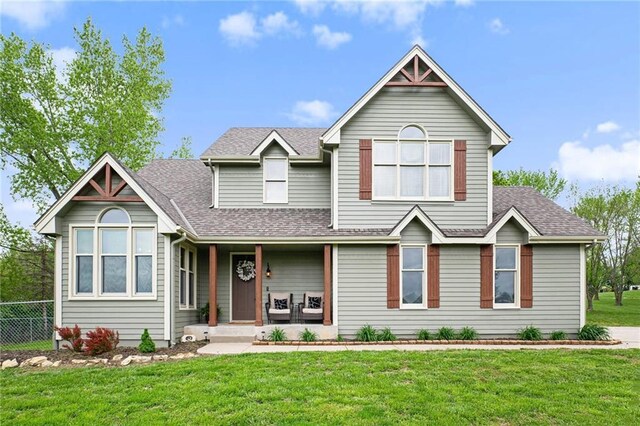 17014 NE 119th St, Kearney, MO 64060 - view of front of house featuring a shingled roof and a porch