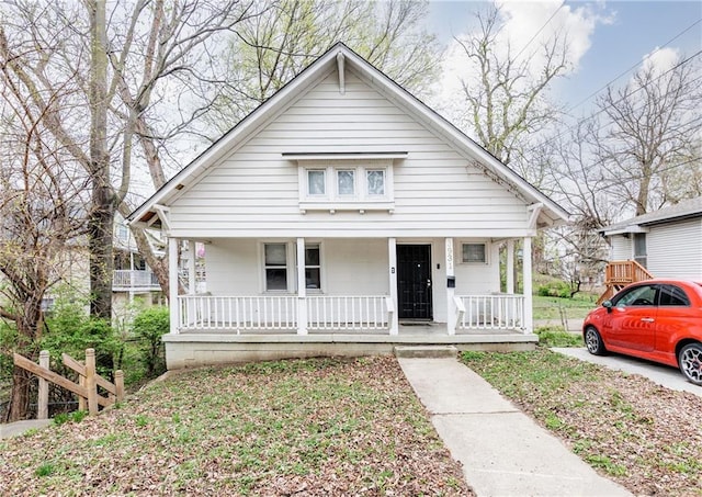3931 Norledge Ave, Kansas City, MO 64123 - bungalow-style home with covered porch